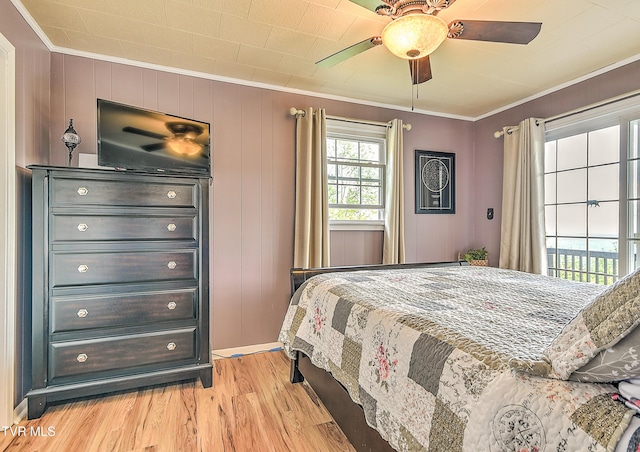 190 Roanwood Rd, Roan Mountain, TN 37687 - bedroom featuring crown molding, ceiling fan, and light wood-style floors