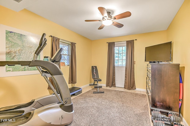 190 Roanwood Rd, Roan Mountain, TN 37687 - workout area featuring baseboards, a ceiling fan, light tile patterned flooring, and light colored carpet