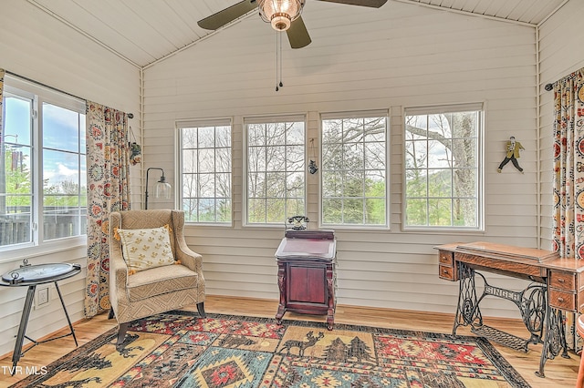 190 Roanwood Rd, Roan Mountain, TN 37687 - living area with a ceiling fan, wood walls, wood finished floors, and lofted ceiling