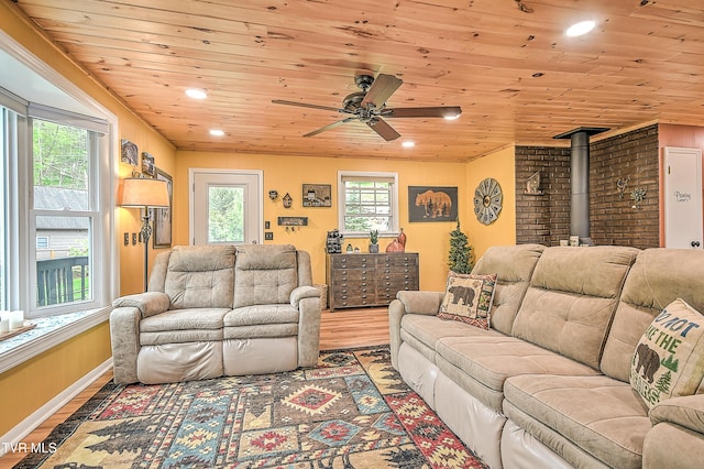190 Roanwood Rd, Roan Mountain, TN 37687 - living room with a wood stove, wood finished floors, ceiling fan, recessed lighting, and wooden ceiling