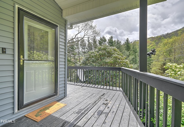 190 Roanwood Rd, Roan Mountain, TN 37687 - deck featuring a view of trees