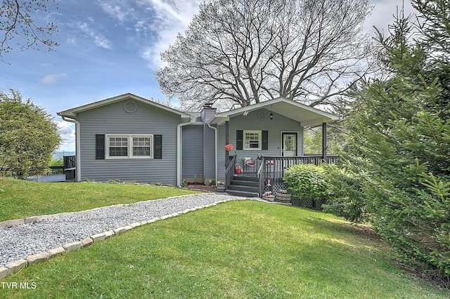 190 Roanwood Rd, Roan Mountain, TN 37687 - view of front of home with a chimney, a front yard, and a porch