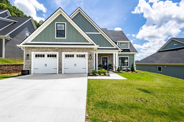 craftsman inspired home with an attached garage, board and batten siding, a front lawn, driveway, and stone siding