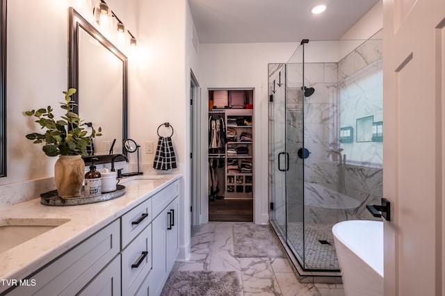 full bathroom with marble finish floors, a marble finish shower, double vanity, a soaking tub, and recessed lighting