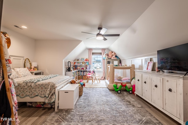 bedroom featuring wood finished floors, vaulted ceiling, and ceiling fan