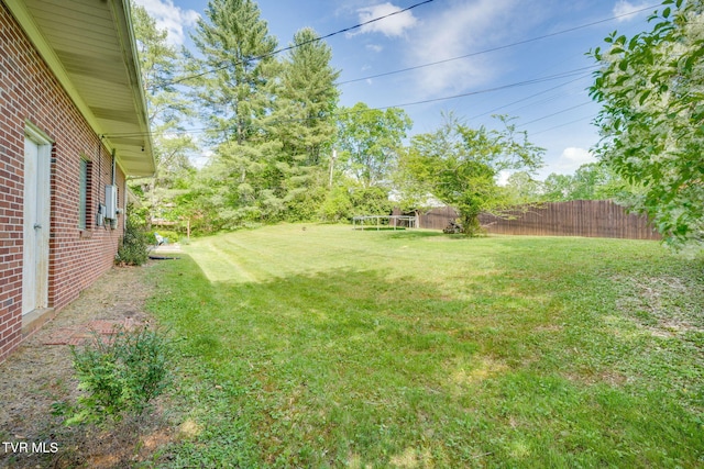view of yard with fence