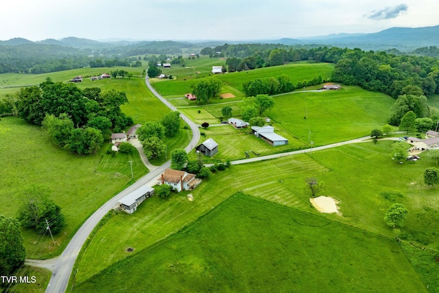 drone / aerial view featuring a mountain view and a rural view
