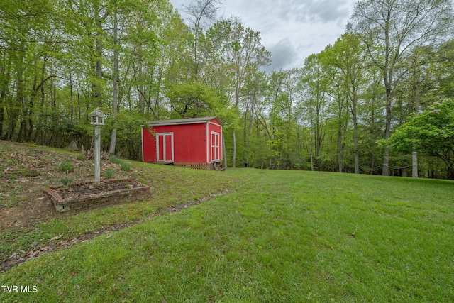 view of yard with an outbuilding and a shed