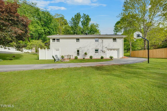 541 Vance Dr, Bristol, TN 37620 - back of house with asphalt driveway, a garage, and stucco siding