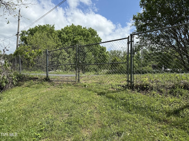 view of gate featuring fence