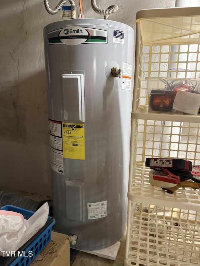 utility room featuring electric water heater
