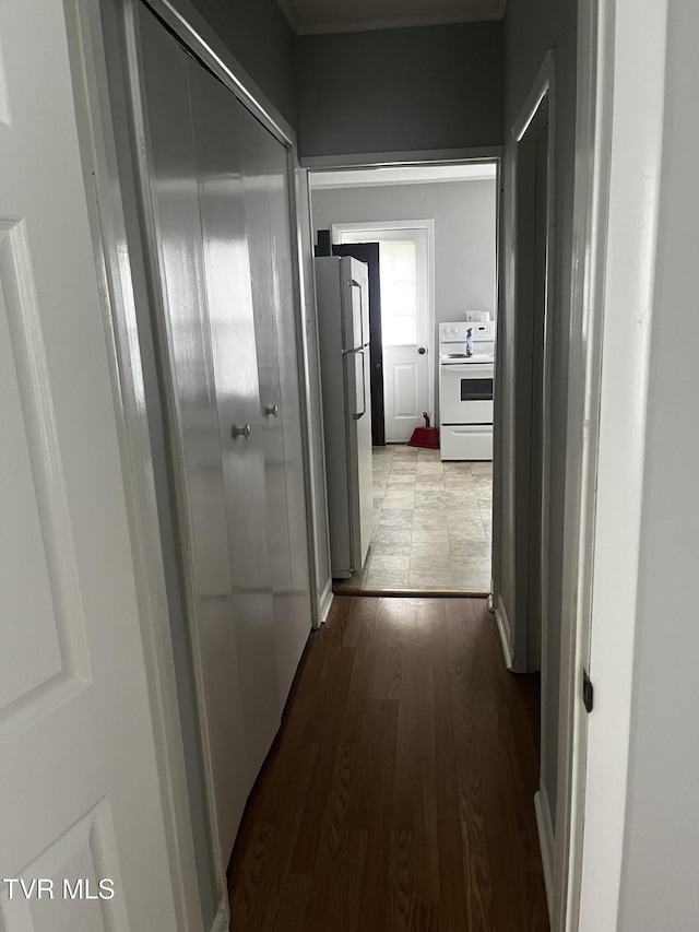hall with wood finished floors