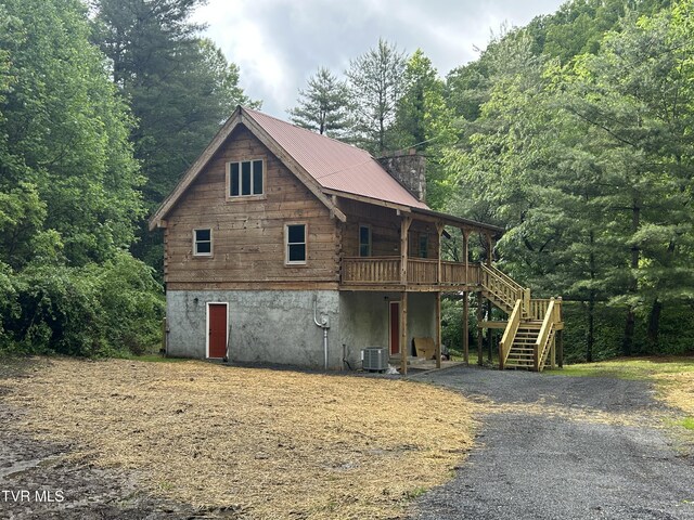 4406 Lawson Hollow Rd, Coeburn, VA 24230 - view of front of home featuring stairs, a chimney, central AC, a view of trees, and a deck
