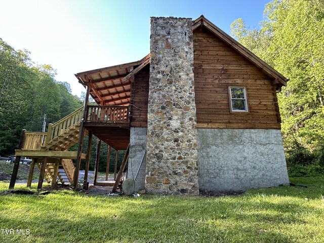 4406 Lawson Hollow Rd, Coeburn, VA 24230 - view of side of home with stairs, a chimney, a lawn, and a deck