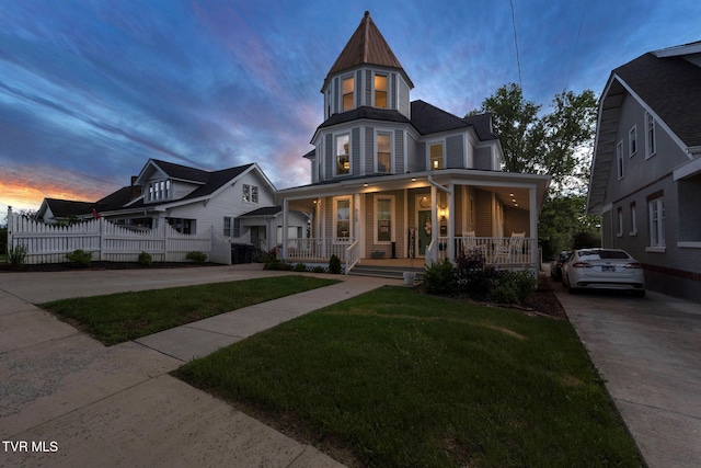 920 Pennsylvania Ave, Bristol, TN 37620 - victorian home featuring a porch, fence, a standing seam roof, and a lawn