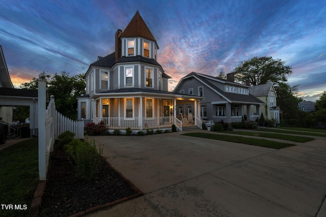 920 Pennsylvania Ave, Bristol, TN 37620 - victorian-style house featuring a front lawn, a porch, driveway, and fence