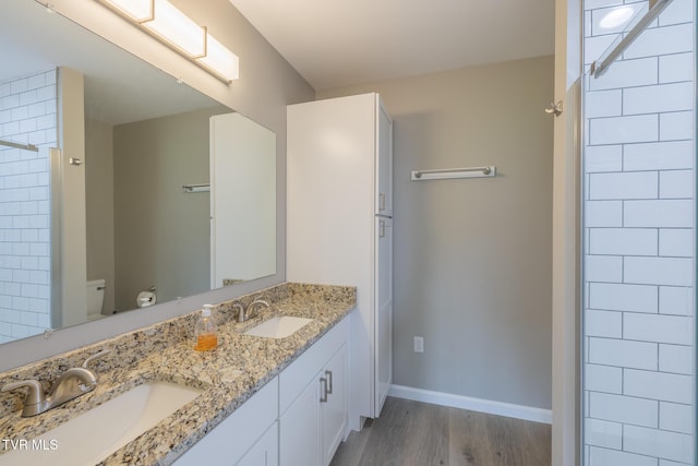116 Weeping Willow Dr Unit 116, Abingdon, VA 24210 - full bathroom featuring wood finished floors, toilet, baseboards, double vanity, and a shower