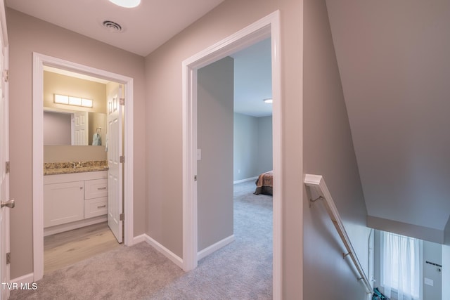 116 Weeping Willow Dr Unit 116, Abingdon, VA 24210 - hall featuring light colored carpet, an upstairs landing, baseboards, and a sink