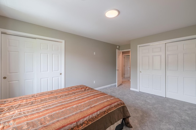 116 Weeping Willow Dr Unit 116, Abingdon, VA 24210 - carpeted bedroom featuring baseboards and two closets