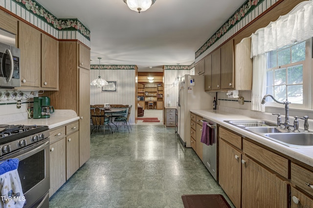 600 Valley Ave, Erwin, TN 37650 - kitchen featuring light countertops, appliances with stainless steel finishes, light floors, and a sink