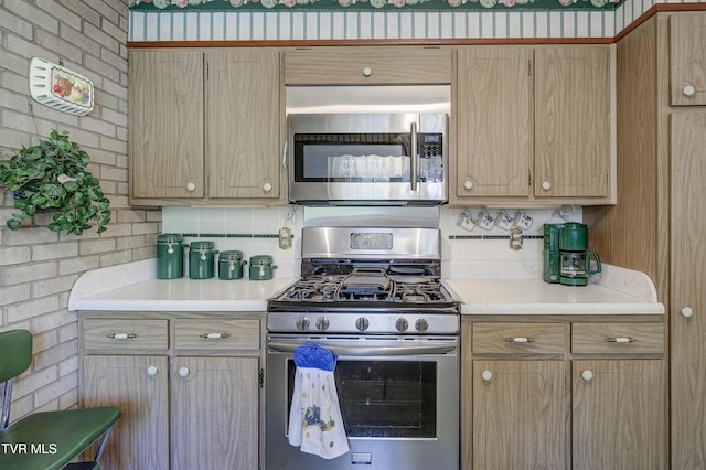 600 Valley Ave, Erwin, TN 37650 - kitchen featuring light countertops, stainless steel appliances, and light brown cabinetry