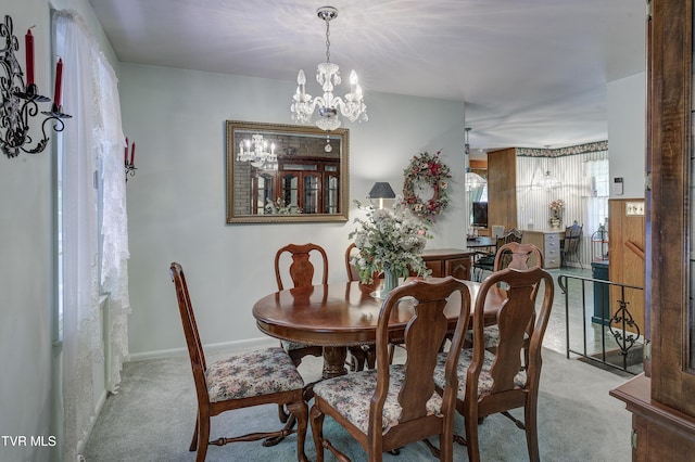 600 Valley Ave, Erwin, TN 37650 - dining area featuring baseboards, a notable chandelier, and carpet