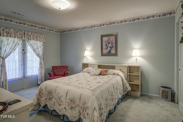 600 Valley Ave, Erwin, TN 37650 - bedroom with baseboards, visible vents, and light colored carpet