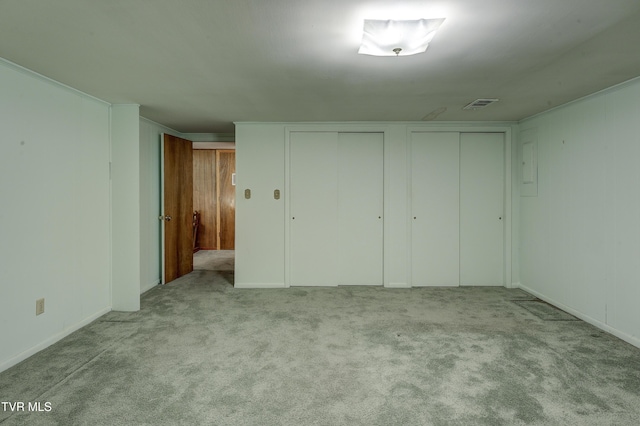 600 Valley Ave, Erwin, TN 37650 - unfurnished bedroom featuring carpet, multiple closets, and visible vents