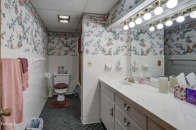 600 Valley Ave, Erwin, TN 37650 - full bath with tile patterned flooring, toilet, a wainscoted wall, and wallpapered walls