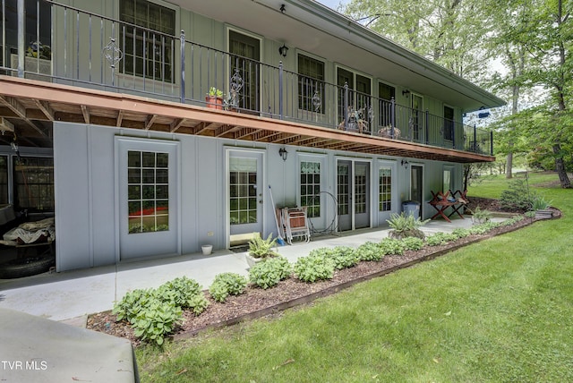 600 Valley Ave, Erwin, TN 37650 - back of property featuring board and batten siding, a patio, a lawn, and a balcony