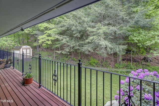 600 Valley Ave, Erwin, TN 37650 - deck featuring fence, an outbuilding, a shed, and a lawn
