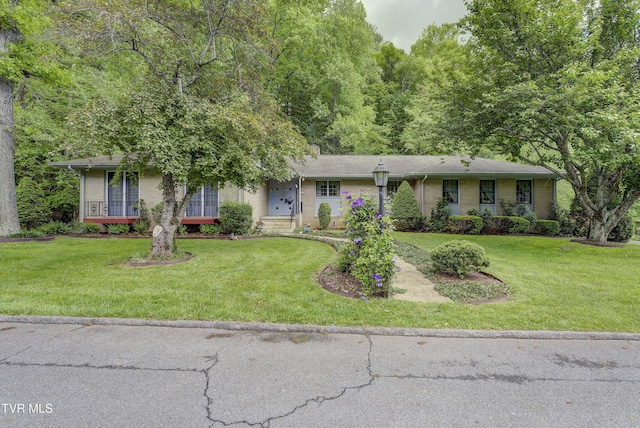 600 Valley Ave, Erwin, TN 37650 - ranch-style house featuring a front lawn and brick siding