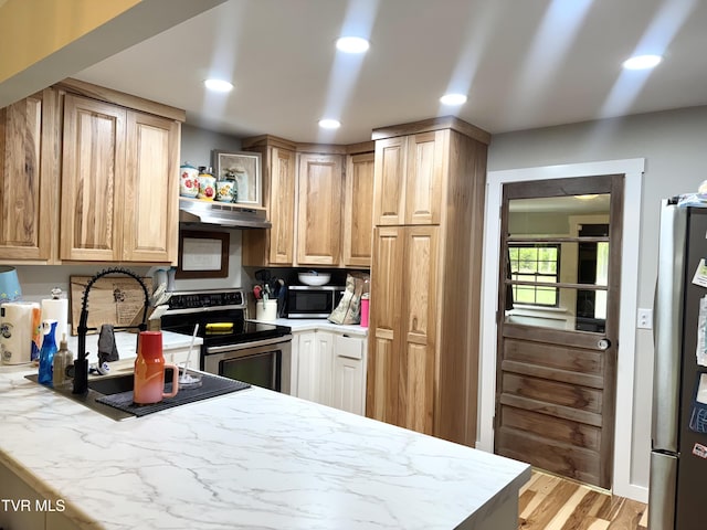 3401 Fairfax Rd, Coeburn, VA 24230 - kitchen with stainless steel appliances, under cabinet range hood, light wood finished floors, recessed lighting, and light brown cabinets