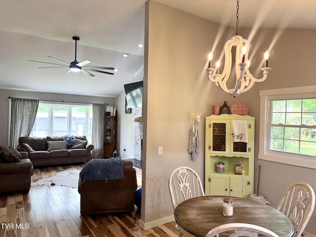 3401 Fairfax Rd, Coeburn, VA 24230 - dining space featuring wood finished floors, ceiling fan, a chandelier, lofted ceiling, and baseboards
