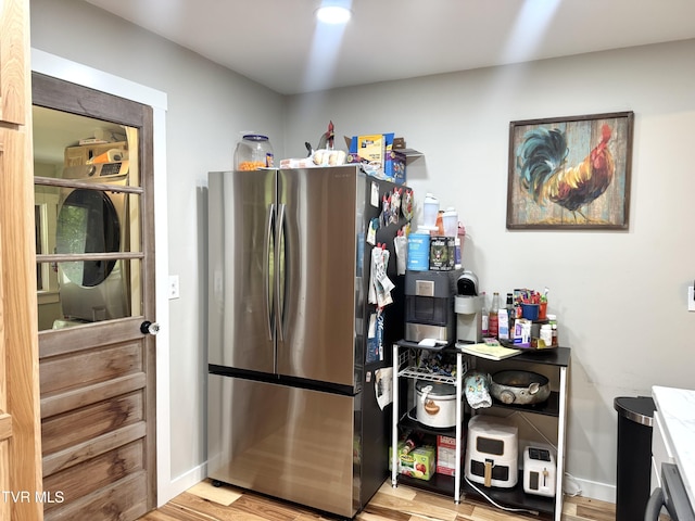 3401 Fairfax Rd, Coeburn, VA 24230 - kitchen with freestanding refrigerator, wood finished floors, and baseboards