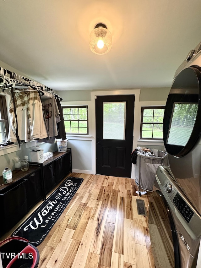 3401 Fairfax Rd, Coeburn, VA 24230 - entrance foyer with stacked washer / drying machine and wood finished floors