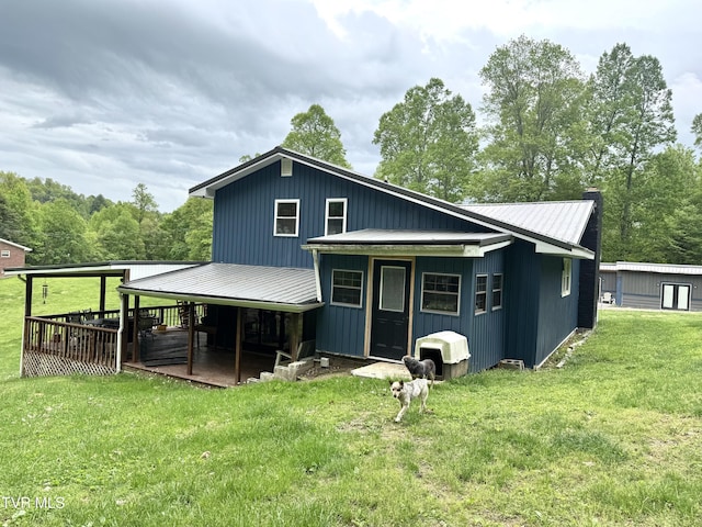 3401 Fairfax Rd, Coeburn, VA 24230 - back of property with a yard, metal roof, and a chimney