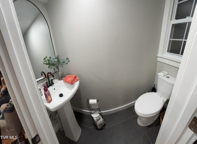 3401 Fairfax Rd, Coeburn, VA 24230 - half bathroom featuring toilet, tile patterned floors, and a sink