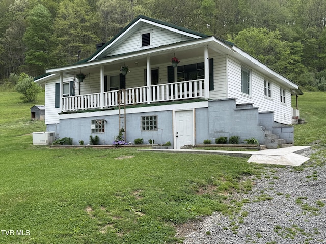 7311 Rocky Fork Rd, Wise, VA 24293 - view of front facade featuring covered porch, a forest view, and a front yard