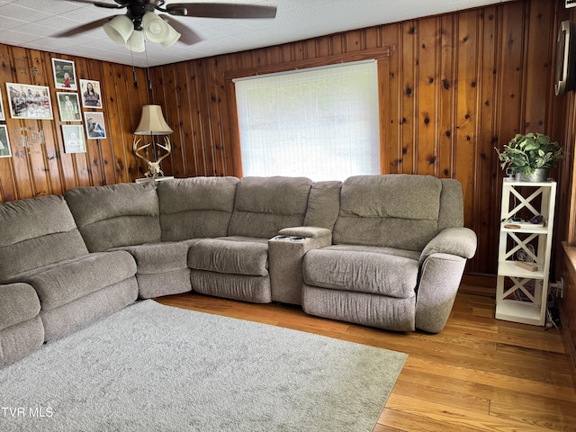 7311 Rocky Fork Rd, Wise, VA 24293 - living area with ceiling fan, wooden walls, and light wood-style flooring