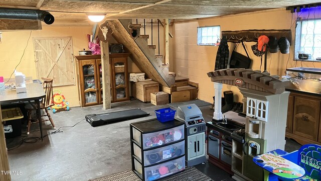 7311 Rocky Fork Rd, Wise, VA 24293 - interior space with concrete block wall and stairs