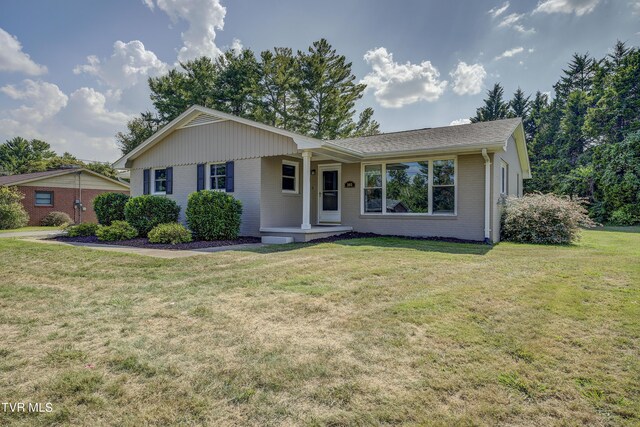 2405 Larkspur Dr, Johnson City, TN 37604 - single story home featuring a porch, brick siding, and a front yard