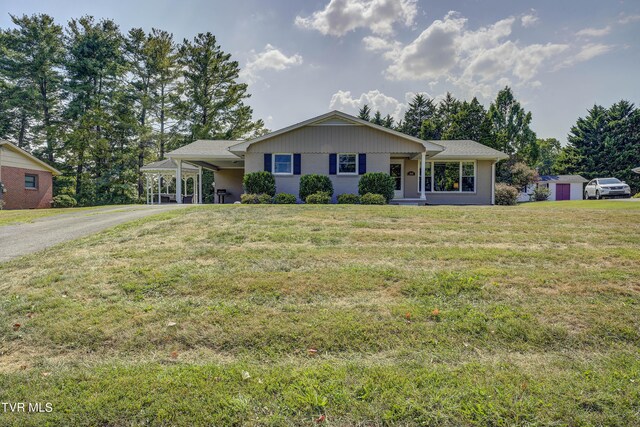 2405 Larkspur Dr, Johnson City, TN 37604 - ranch-style house with an attached carport, aphalt driveway, and a front lawn