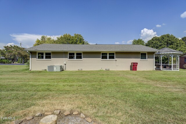 2405 Larkspur Dr, Johnson City, TN 37604 - rear view of house featuring a yard, a gazebo, a shingled roof, and central air condition unit