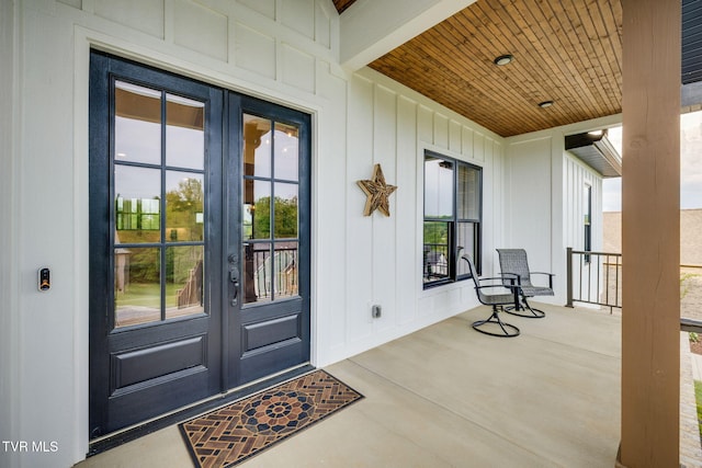 doorway to property featuring french doors and a porch