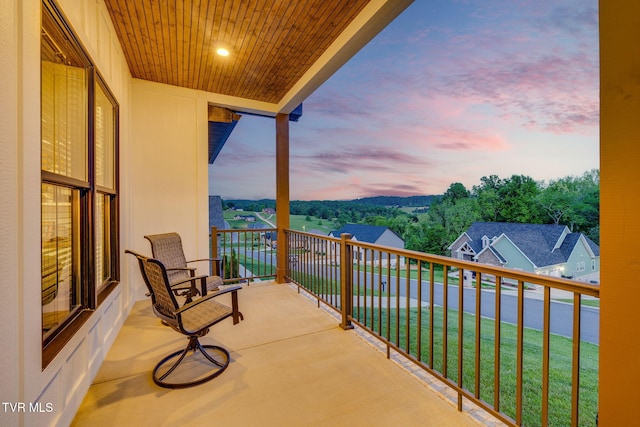 view of balcony at dusk
