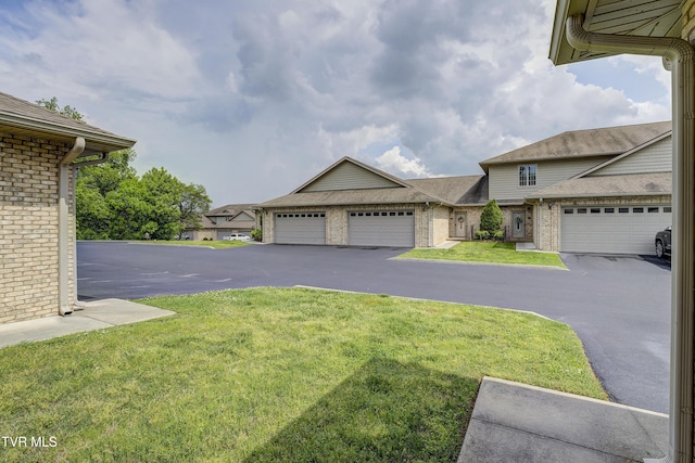 575 Boring Chapel Rd Unit 31, Johnson City, TN 37615 - view of yard featuring aphalt driveway and a garage