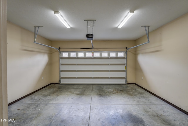 575 Boring Chapel Rd Unit 31, Johnson City, TN 37615 - garage featuring baseboards and a garage door opener