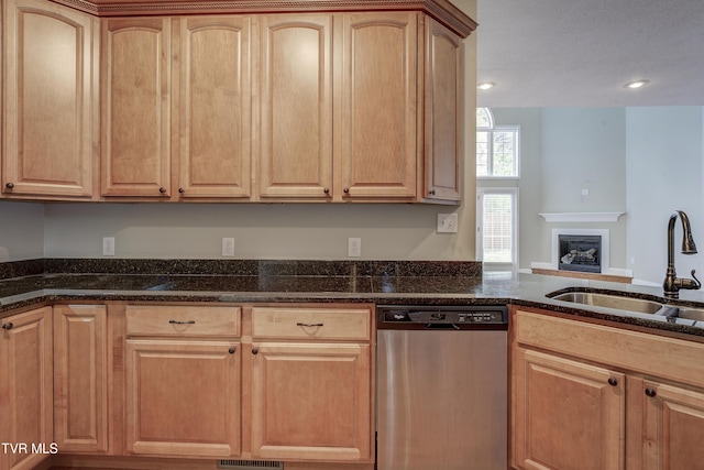 575 Boring Chapel Rd Unit 31, Johnson City, TN 37615 - kitchen featuring dark stone countertops, light brown cabinetry, a sink, dishwasher, and a fireplace with raised hearth