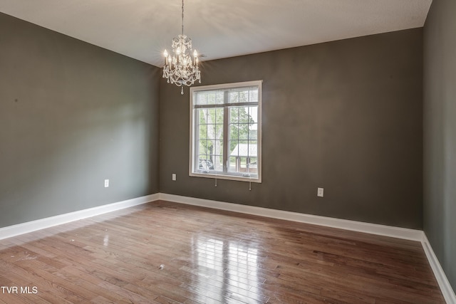 575 Boring Chapel Rd Unit 31, Johnson City, TN 37615 - spare room featuring an inviting chandelier, baseboards, and wood-type flooring